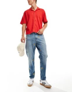 Tommy Jeans Isaac Relaxed Tapered Jeans In Mid Wash With Crest Details For Men Denim Medium -Tommy Hilfiger Store 206859193 3